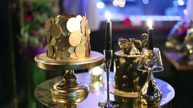exclusive luxury black and gold cake and burning black candles for birthday anniversary wedding celebration
