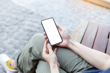 cell phone Mockup image blank white screen.woman hand holding texting using mobile on desk at coffee shop.background empty space for advertise.work people contact marketing business,technology