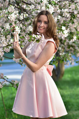 Girl with Apple tree flowers pink color