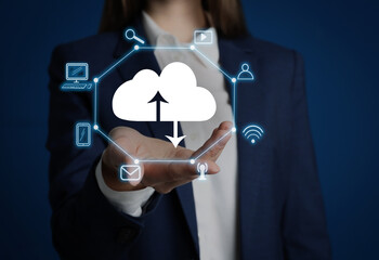 Modern storage technology concept. Woman demonstrating image of cloud with icons on blue...