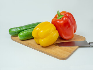Delicious cuisine. Fresh vegetables on a wooden board, ready for slicing lettuce