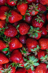 Top background view on lots of strawberries macro vertical, directly above