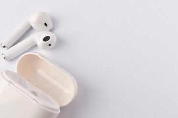 A white wireless headphone on white background.