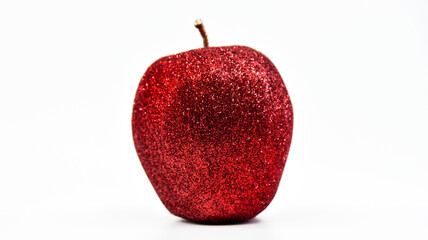 Glittery red apple with white background