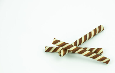 The two-tone wafer roll stick chocolate flavor on white background.