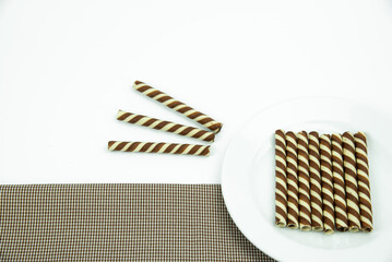 The two-tone wafer roll stick chocolate flavor on white background.