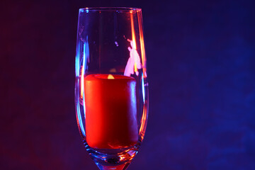 Candle with smoke and flame photographed in the studio with color foils before the flashes