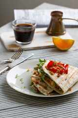 Tortilla wrap with eggs,arugula and tomatoes