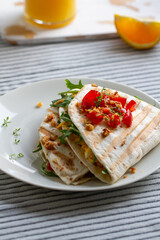 Tortilla wrap with eggs,arugula and tomatoes