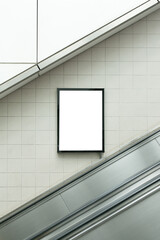 Small billboard beside the escalator.