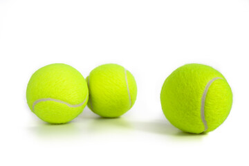 Tennis balls isolated on white. Still-life photo taken on studio with white background and softbox.