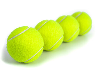 Tennis balls isolated on white. Still-life photo taken on studio with white background and softbox.