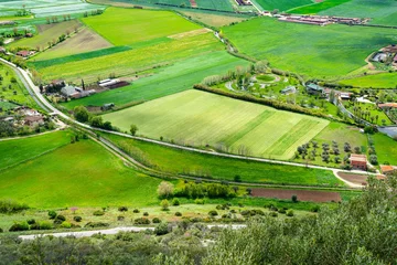 Foto op Plexiglas The wonderful landscape of southern Italy in spring. View from the high mountain to the green valley. Cultivated fields, meadows, farms, homesteads, roads, olive groves, shrubs, trees © edita
