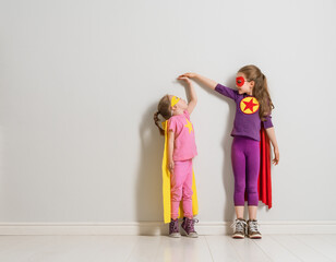 children are playing superhero