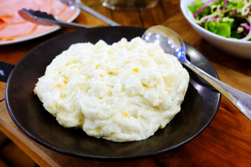 Close up Mashed Potatoes on the Wooden Table.