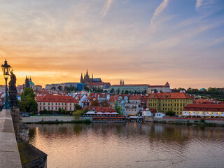 Naklejka na ściany i meble Amazing sunset over Prague town, Vltava river and Vitus Cathedral