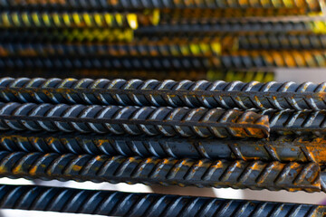 a stack of steel rebar at a constuction site