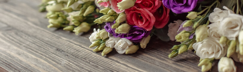 Bouquet of flowers on wooden background. Abstract spring background with bloom.