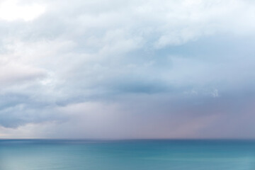 Naklejka na ściany i meble Aerial view of heavy rain clouds over Tasman sea horizon