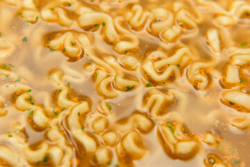 closeup noodle soup with seasoning
