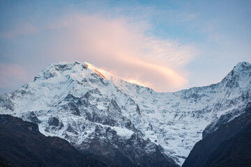 Colorful Sunrise on Snowy Annapurna Peak with Pink Clouds