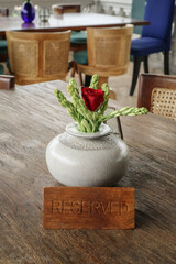 Wooden reserved sign on a  table