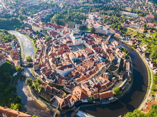 Obraz premium Aerial view on a small city surrounded by a river