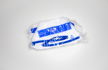 white asepticnew face masks protection against covid19  frontal view envelope in plastic