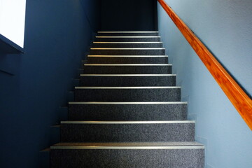 Close up Stair Steps with Light Beam from Window on Wall Surface.