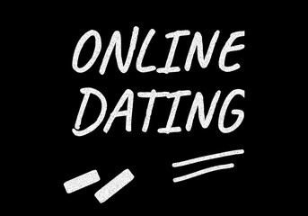 Online dating writing on black chalkboard