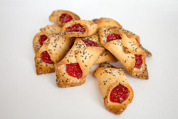 shortbread cookies with jam and poppy seeds isolated on a white background, close