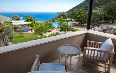 beautiful balcony, terrace with chairs and table. Beautiful sea and mountain landscape. Hotel room and resort view. ,