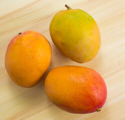 Mango fruit on a wooden background