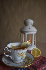 Cup of tea with lemon on the table