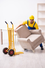 Young male contractor in relocation concept