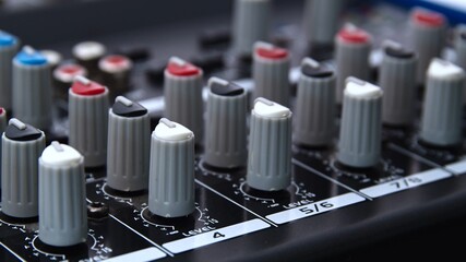 Close up of an audio mixer knobs - mixing console control desk