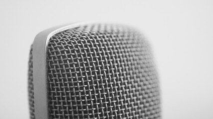 Close up shot of a studio condenser vocal mic - professional microphone - white background
