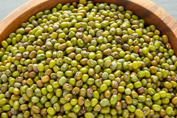 Mung beans or mash peas in wooden bowl
