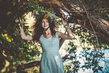 Girl in a wreath of wildflowers at the festival Midsummer