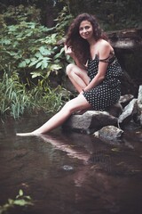 Girl in a wreath of wildflowers at the festival Midsummer