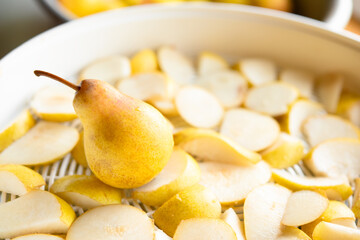 Fototapeta na wymiar Homemade drying dehydration process of pears close-up