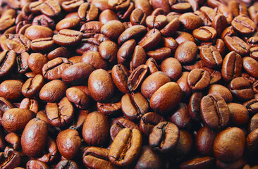 Roasted coffee beans background. Top view. Space for text.