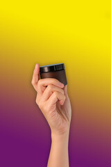 hand hold cosmetic skincare on pink background.beauty banner.