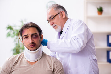 Young face injured man visiting experienced male doctor traumato