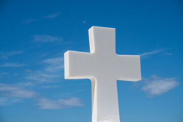 white cross on blue sky