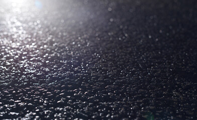 The surface of the night road and the backlight of the lamp.