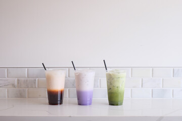thai ice tea with taro milk tea and matcha green tea.