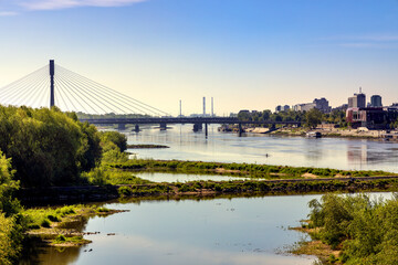 Panoramic view of Vistula river in central Warsaw, Poland with Swietokrzyski Bridge - Most Swietokrzyski - linking Powisle and Praga Polnoc districts