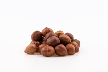 Heap of hazelnuts isolated on white background