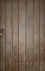 Abstract texture of old wooden door with padlock